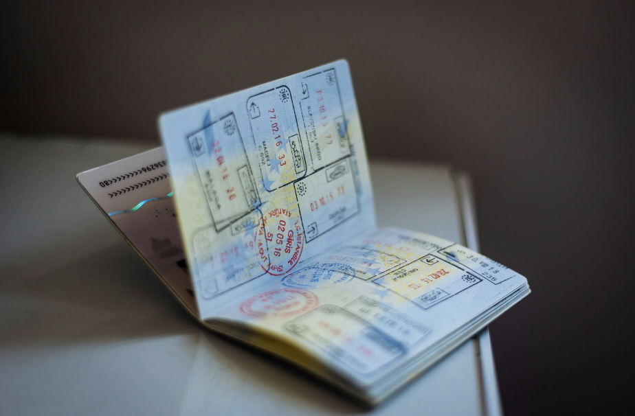 a passport open to display multiple stamps