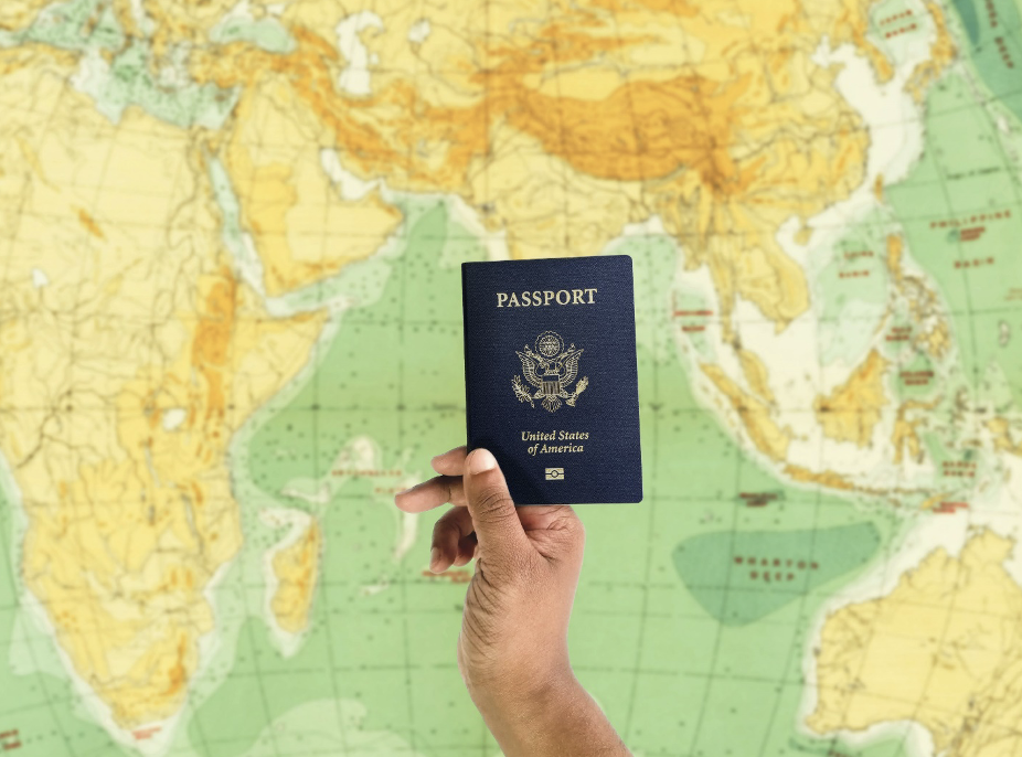 an individual holding up their US passport